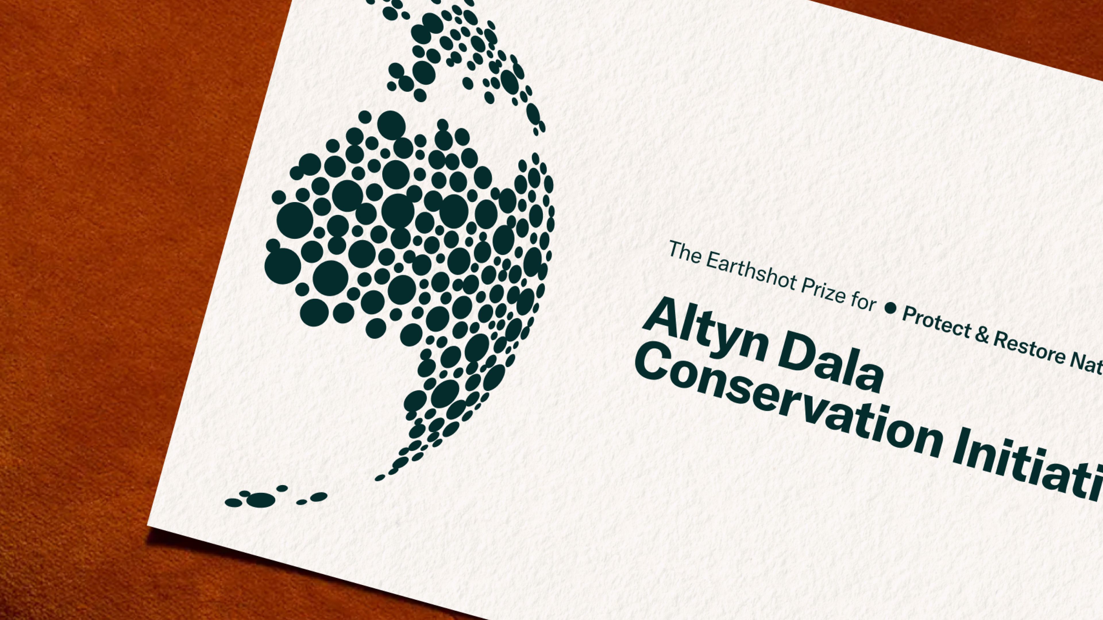 A image of The Earthshot Prize branding as a printed invitation for the event in Cape Town