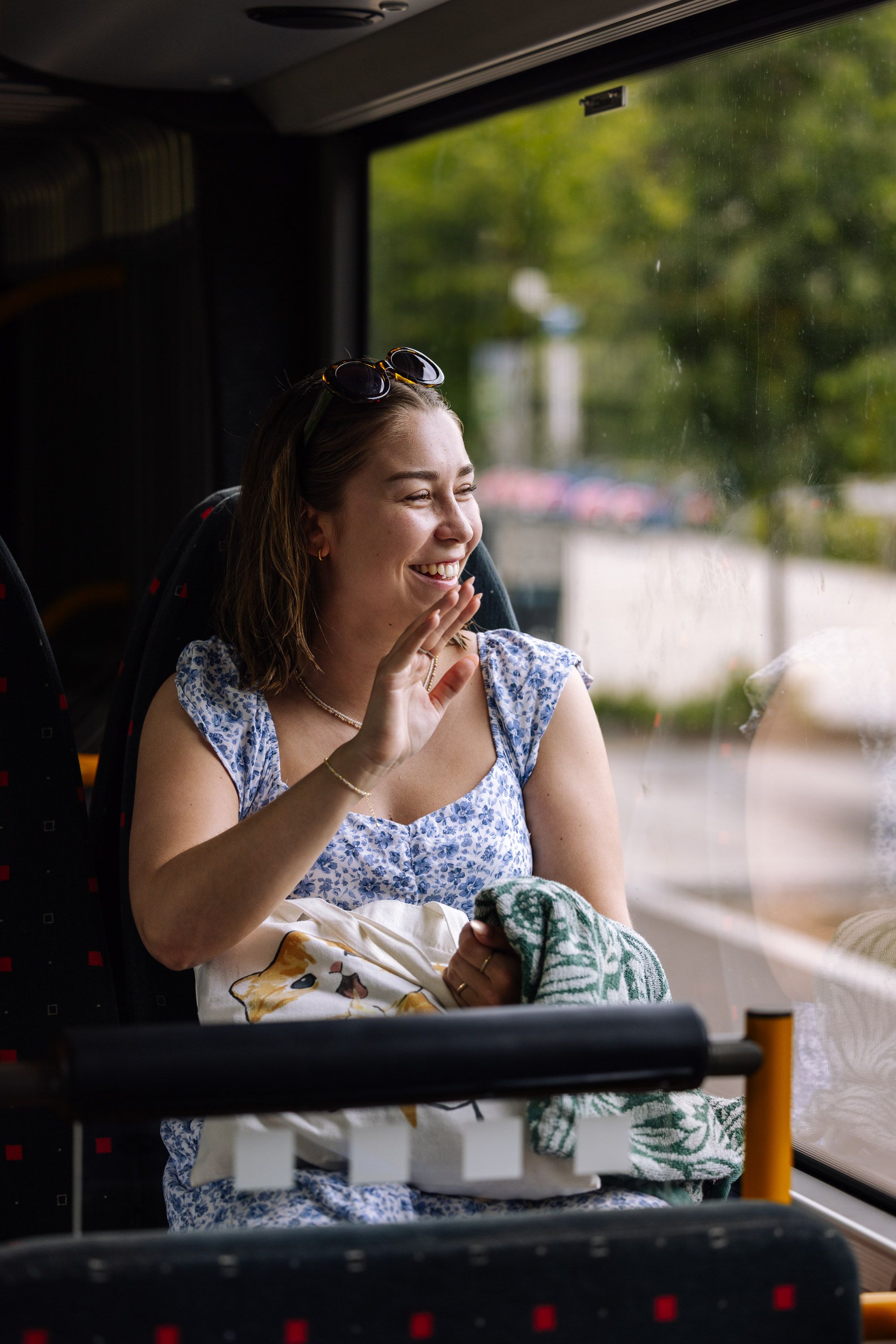 Woman looking out the window of the bus