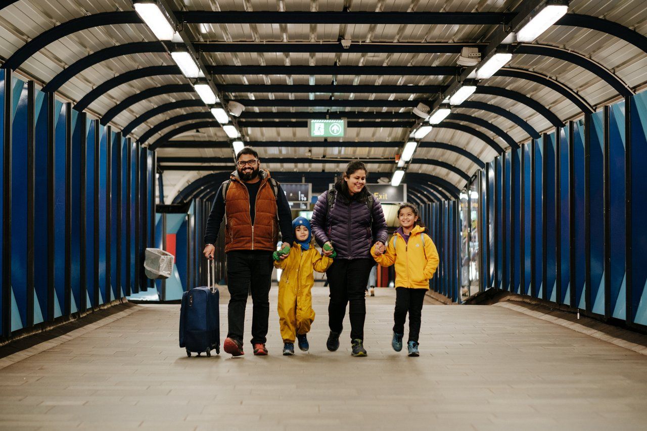 A familiy at the metro station