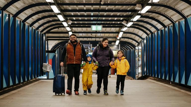A familiy at the metro station
