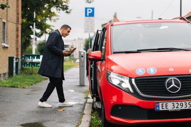 a car picking up a man
