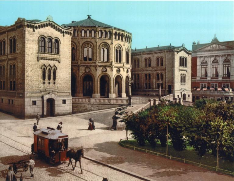 A horse pulls a tramway infront of Stortinget in 1895