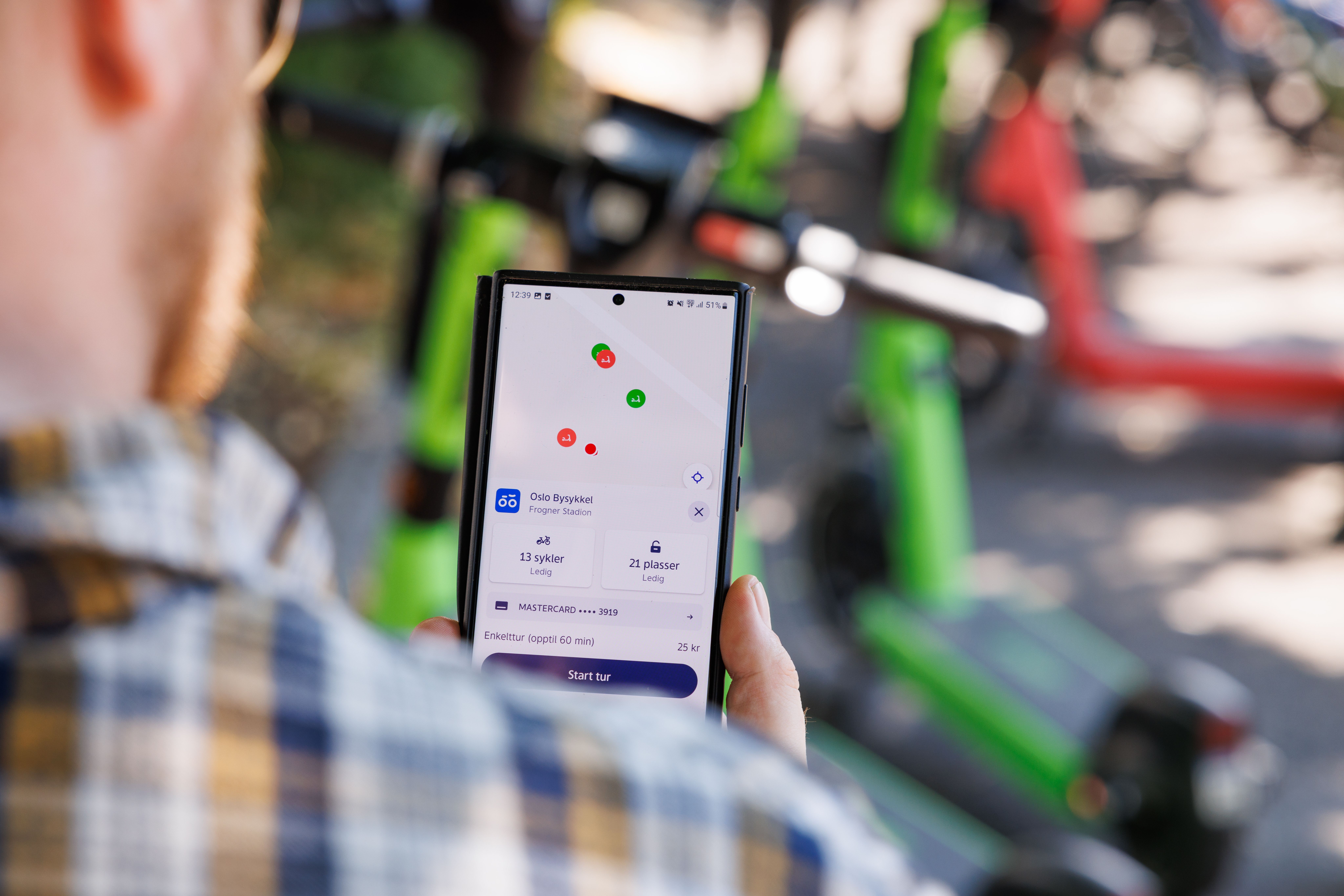 A man uses the app to rent a scooter