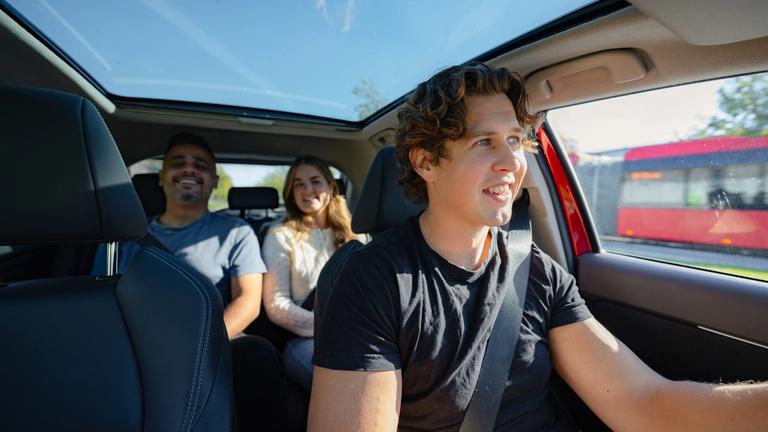 Three people carpooling to work