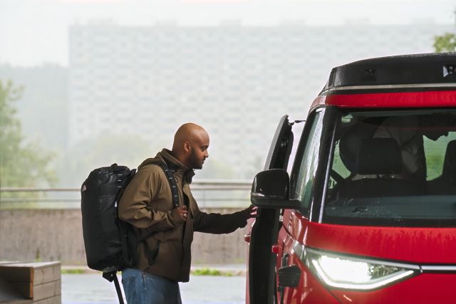 A man heading into a self driving car