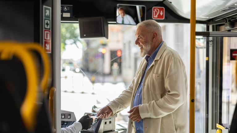 Old man entering the bus