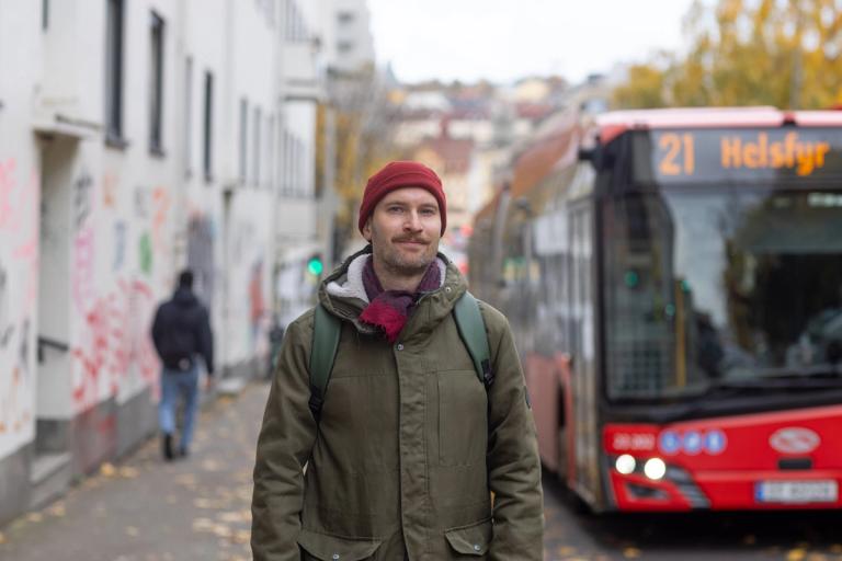A man in front a bus stop