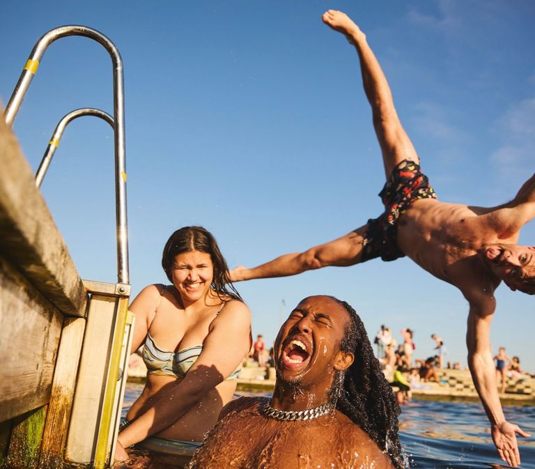 Happy young adults taking a bath