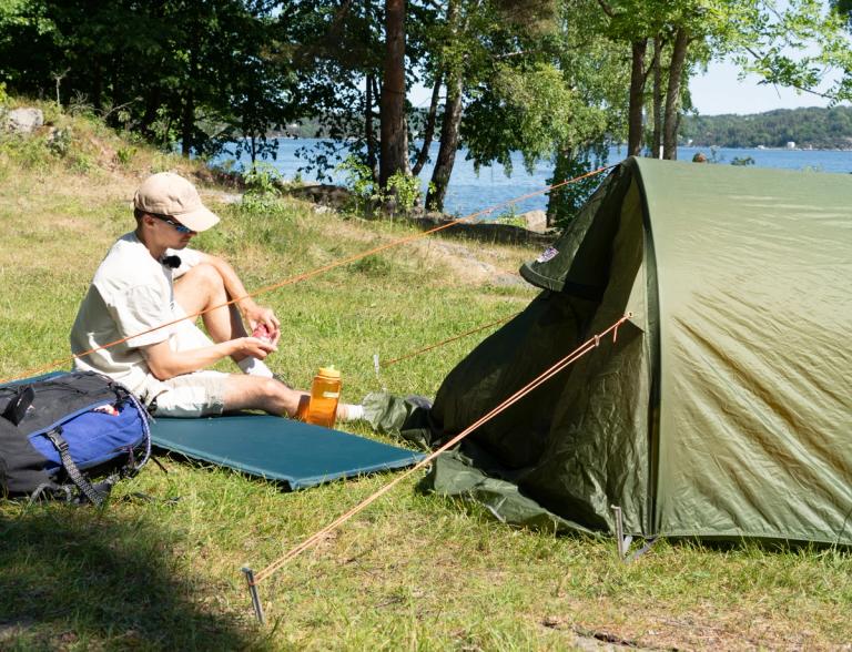 A young man camping