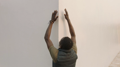 Matthieu Kasiama with White Cube (still from White Cube, Renzo Martens)