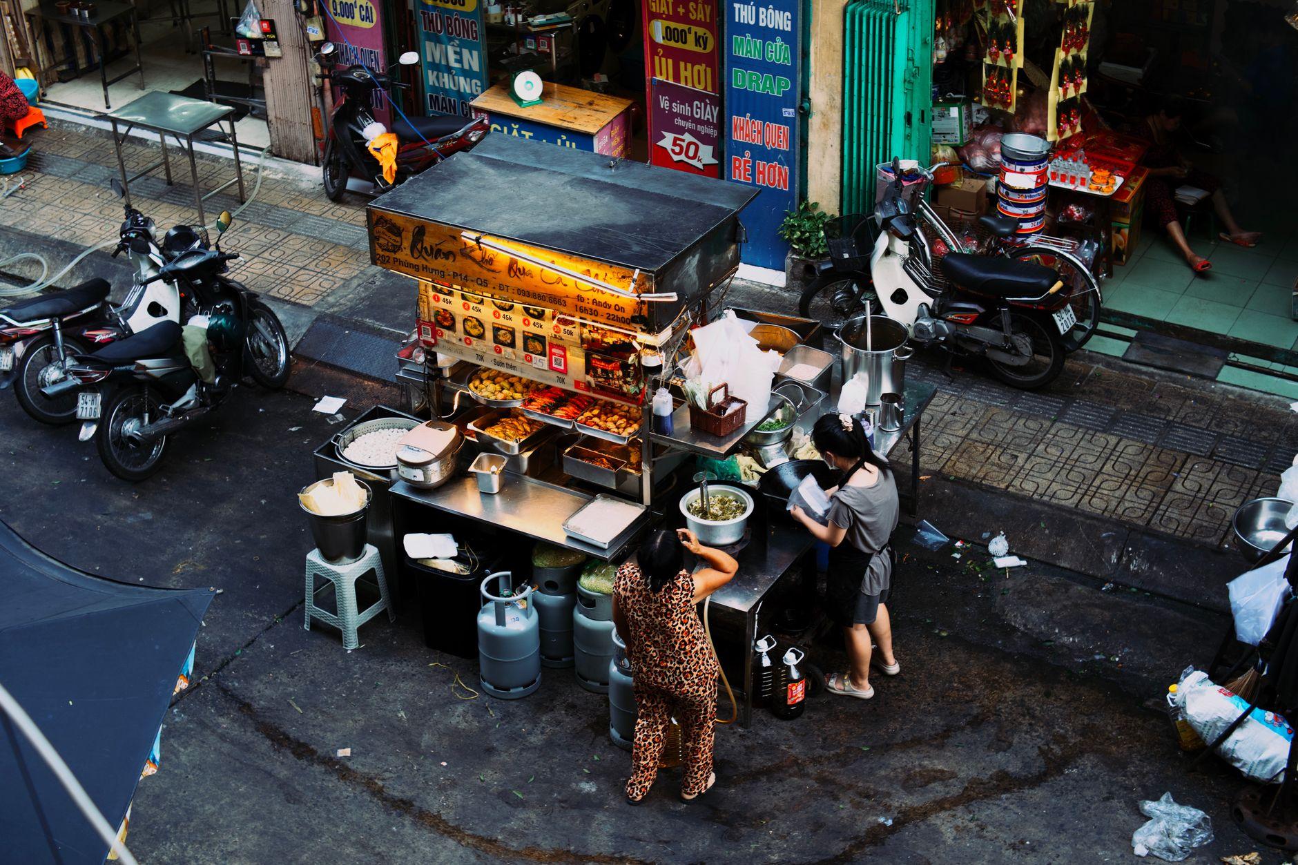 The Laminated Card Taped to the Bánh Mì Cart Is How Vietnam Wants You to Pay