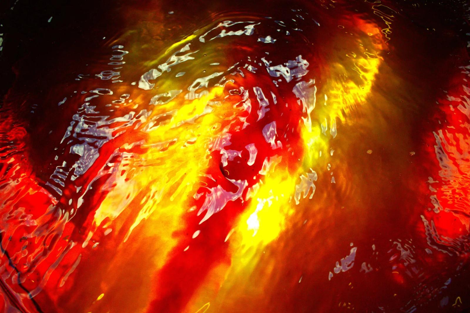 Bysco Kombucha's homepage hero: a close-up of red and gold kombucha swirling in liquid.
