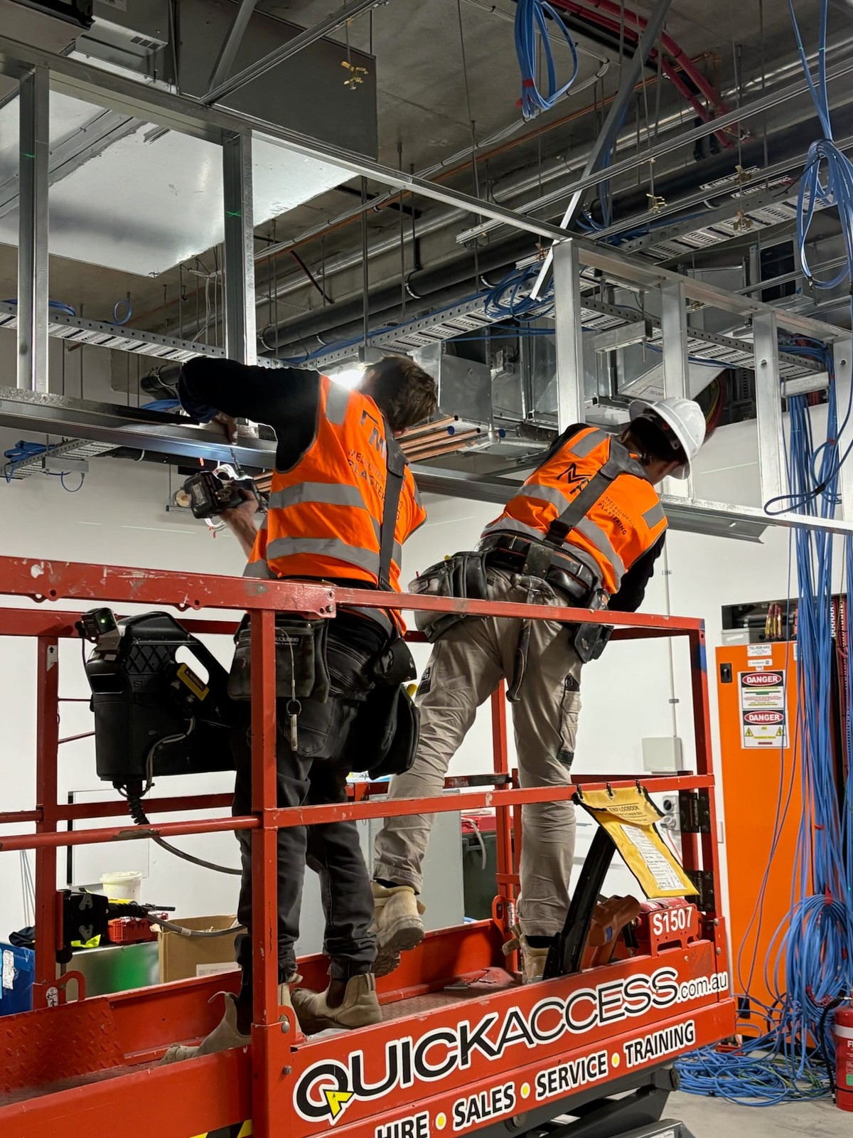 Pillar crew working overhead on the Dose Pharmacy fitout