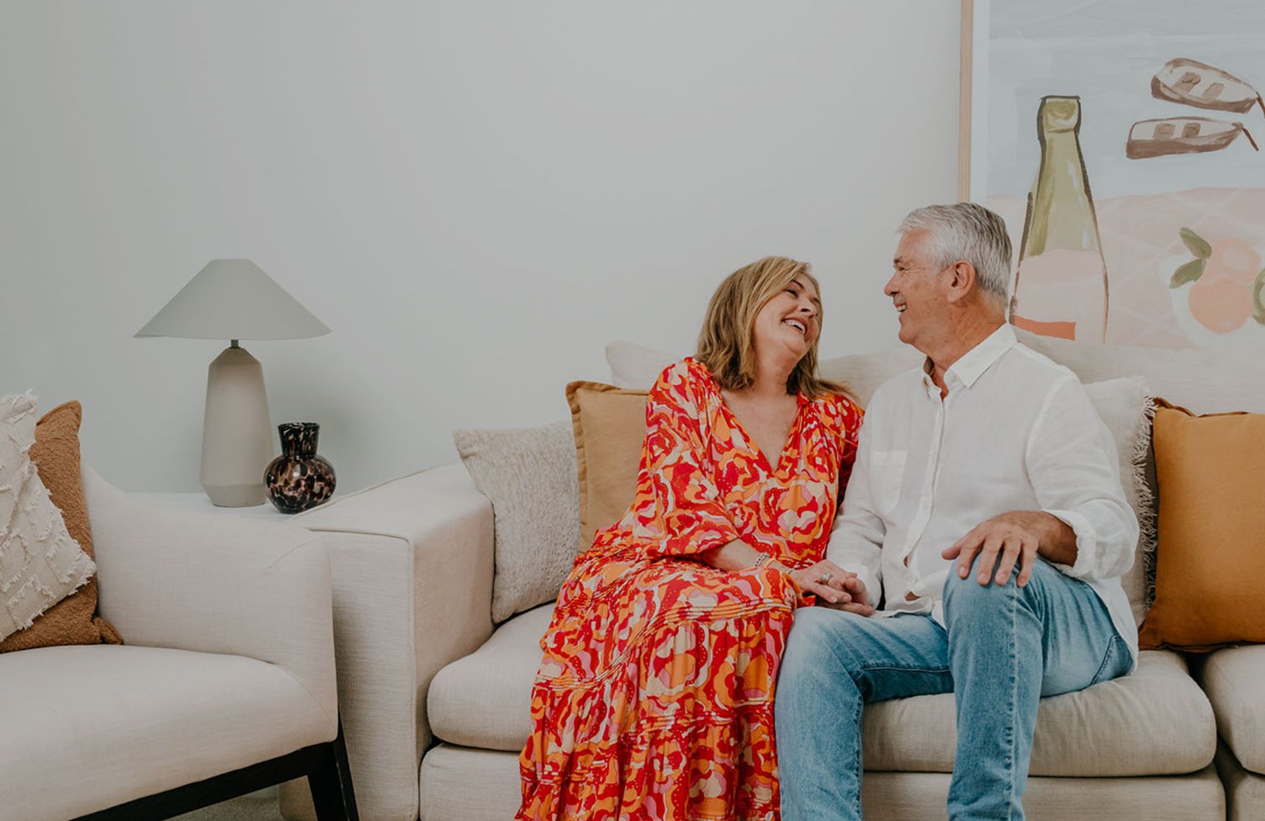 Happy retired couple enjoying their new home