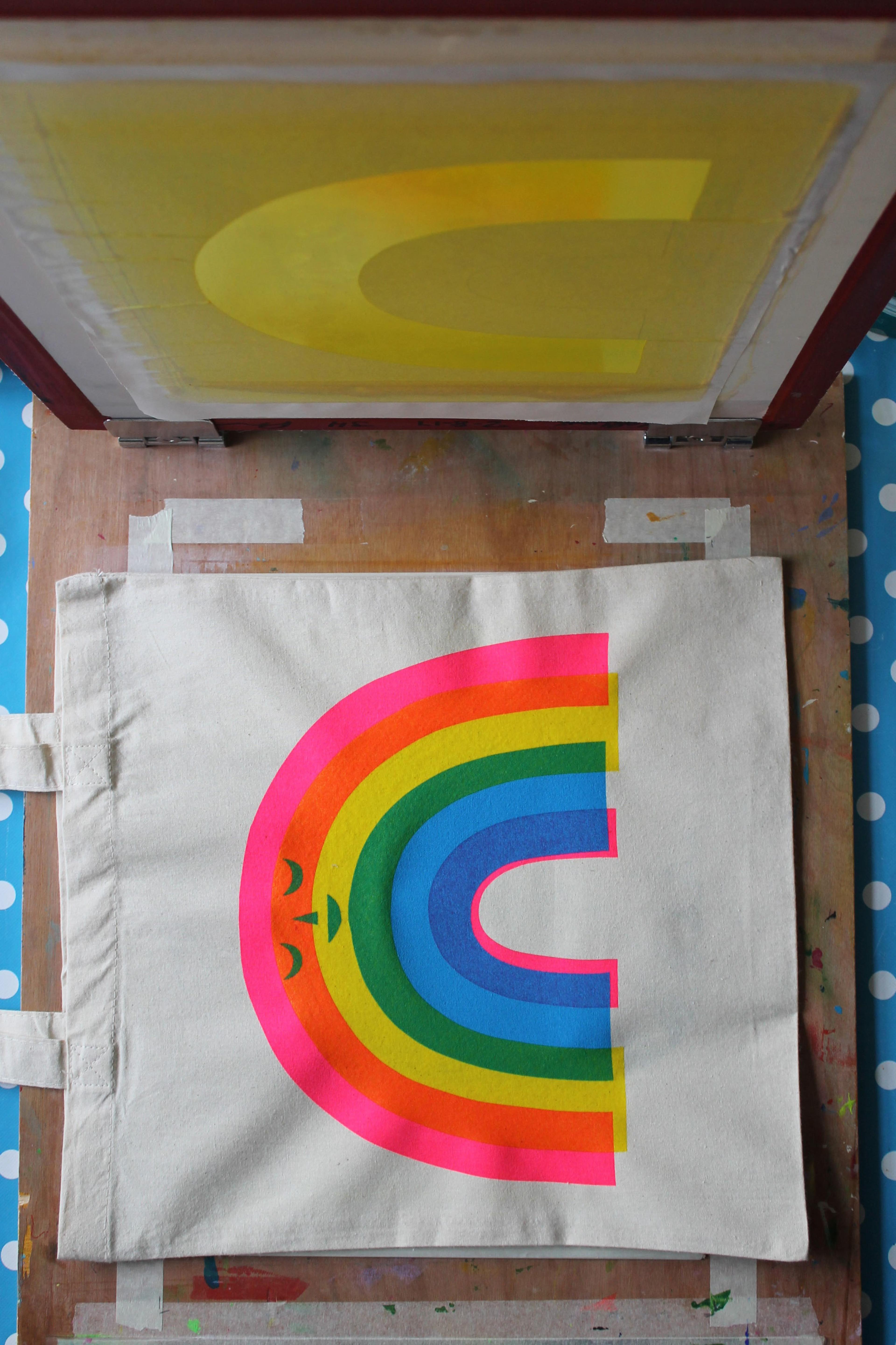 photo of fluorescent rainbow screenprint process