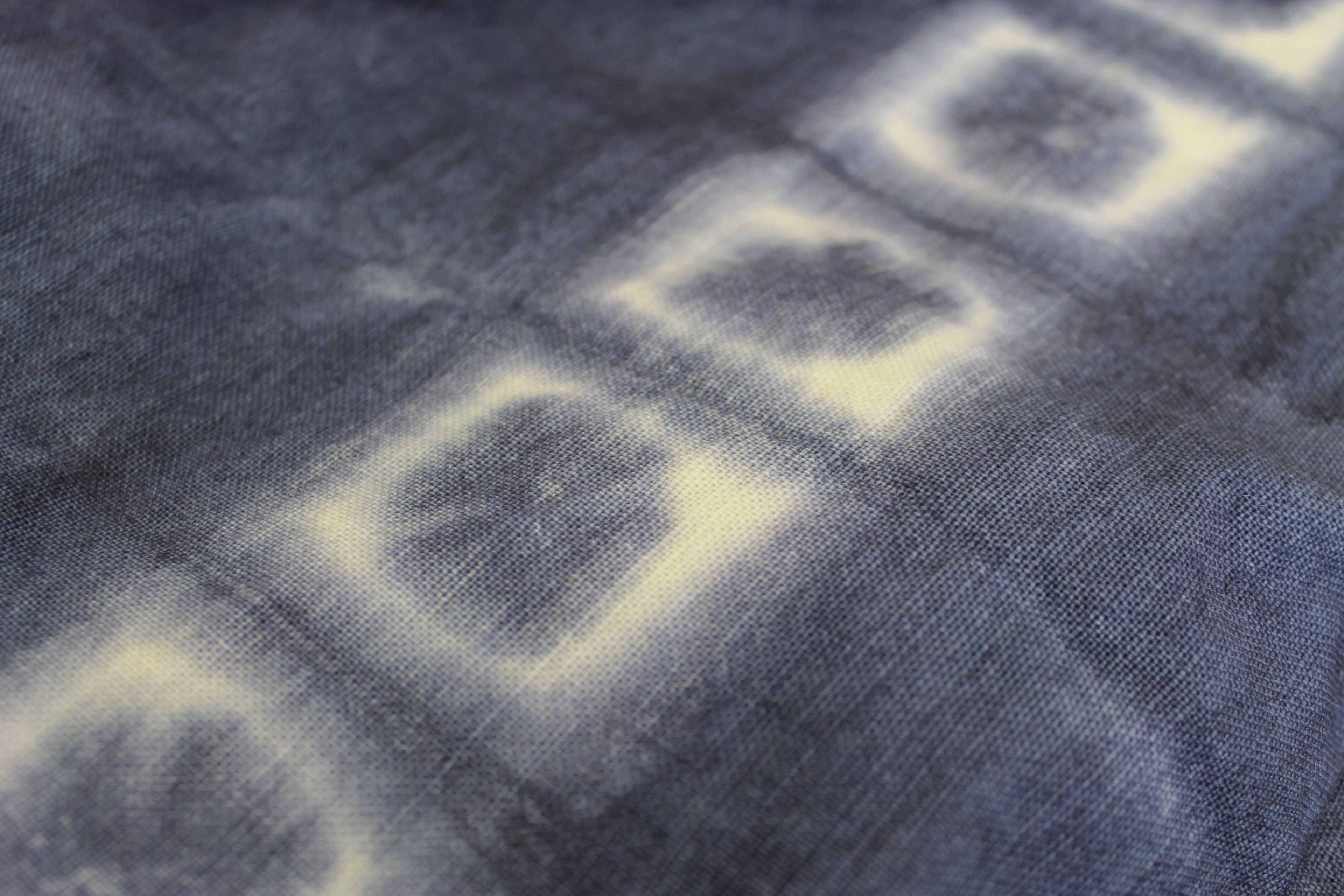 shibori dyed textile; indigo background white squares