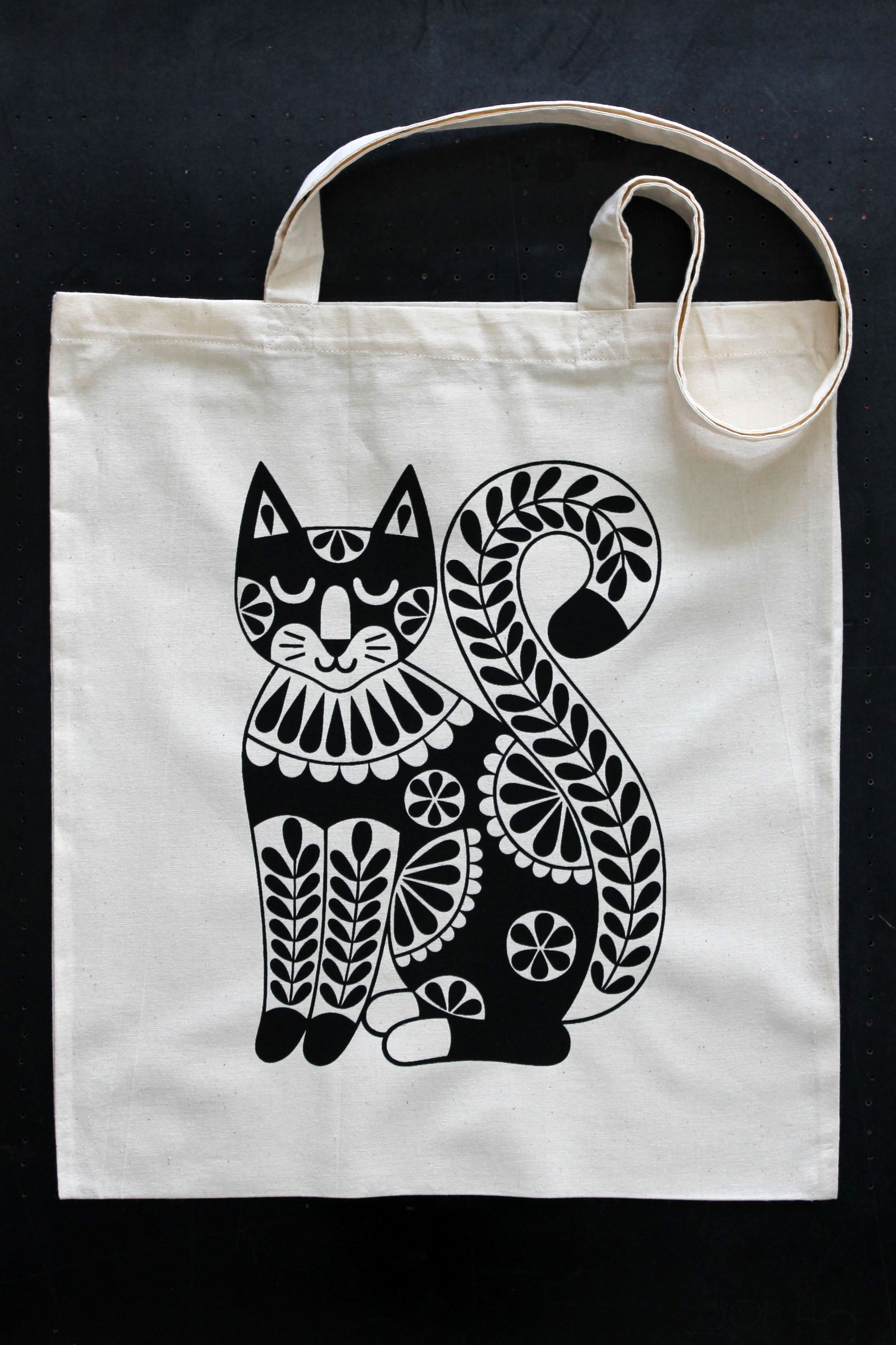 photo of screenprinted tote bag black graphic cat