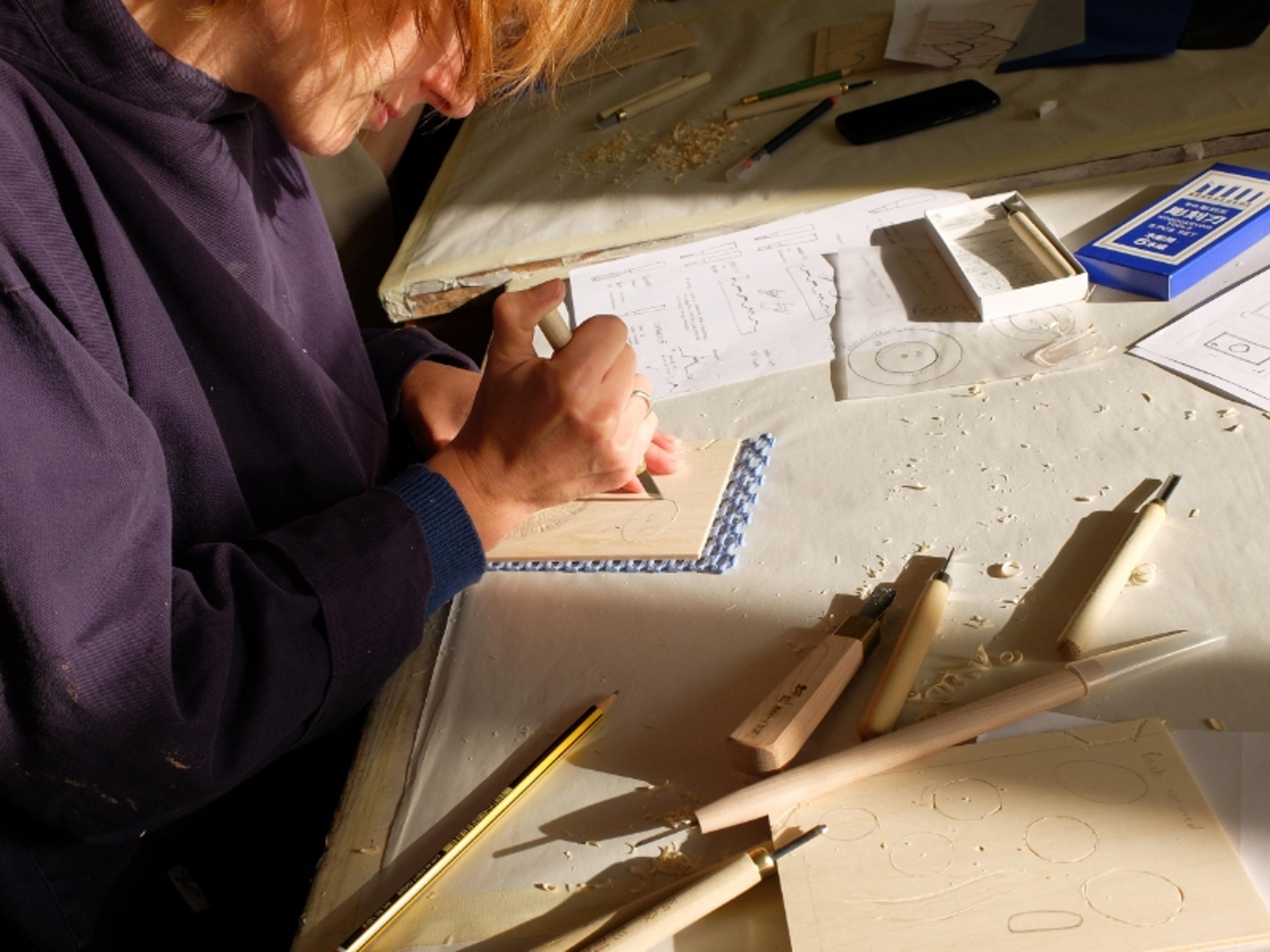 photo of Lucy producing mokuhanga prints in a studio