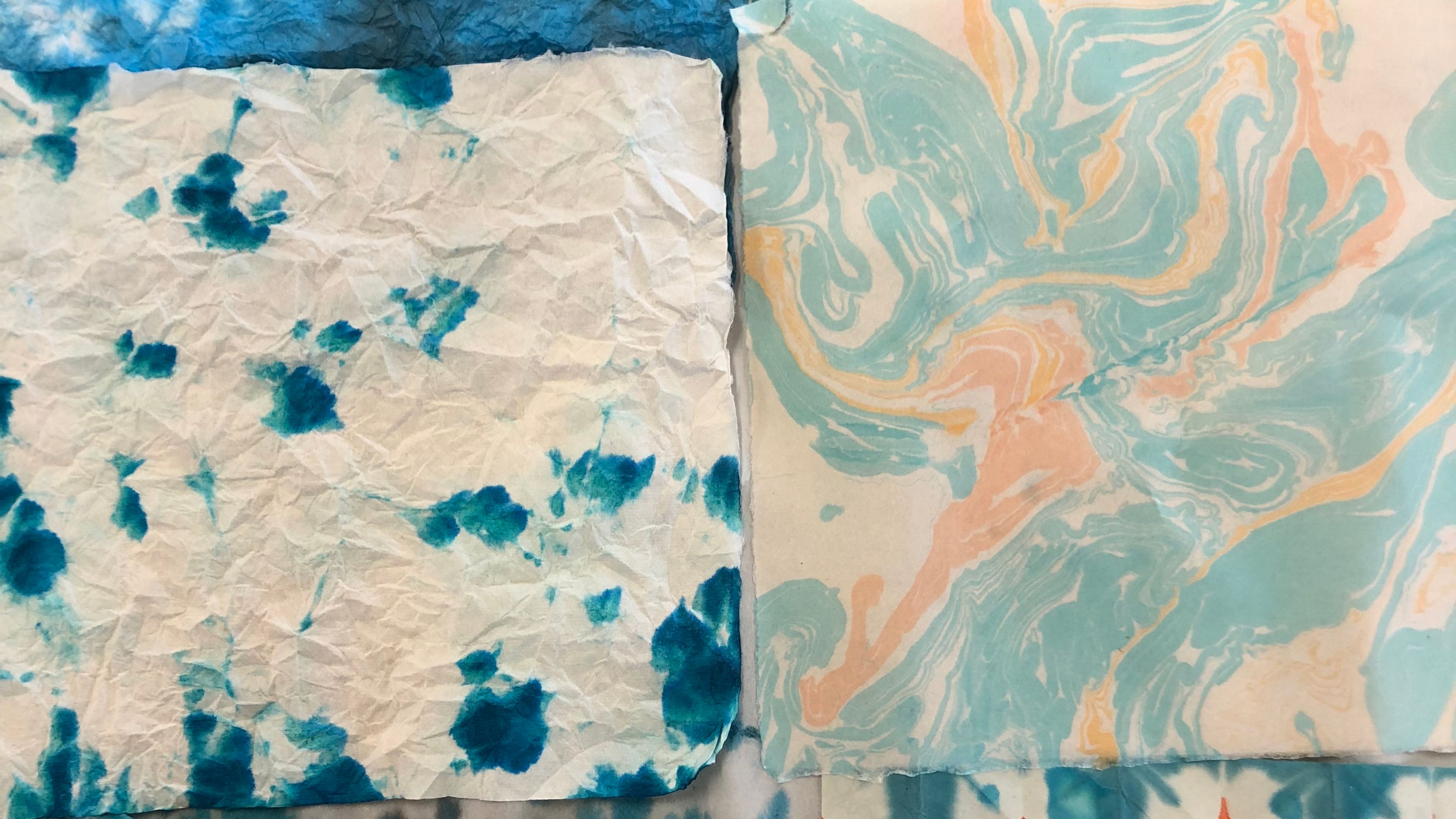examples of marbling; multiple patterns and muted cyan colours