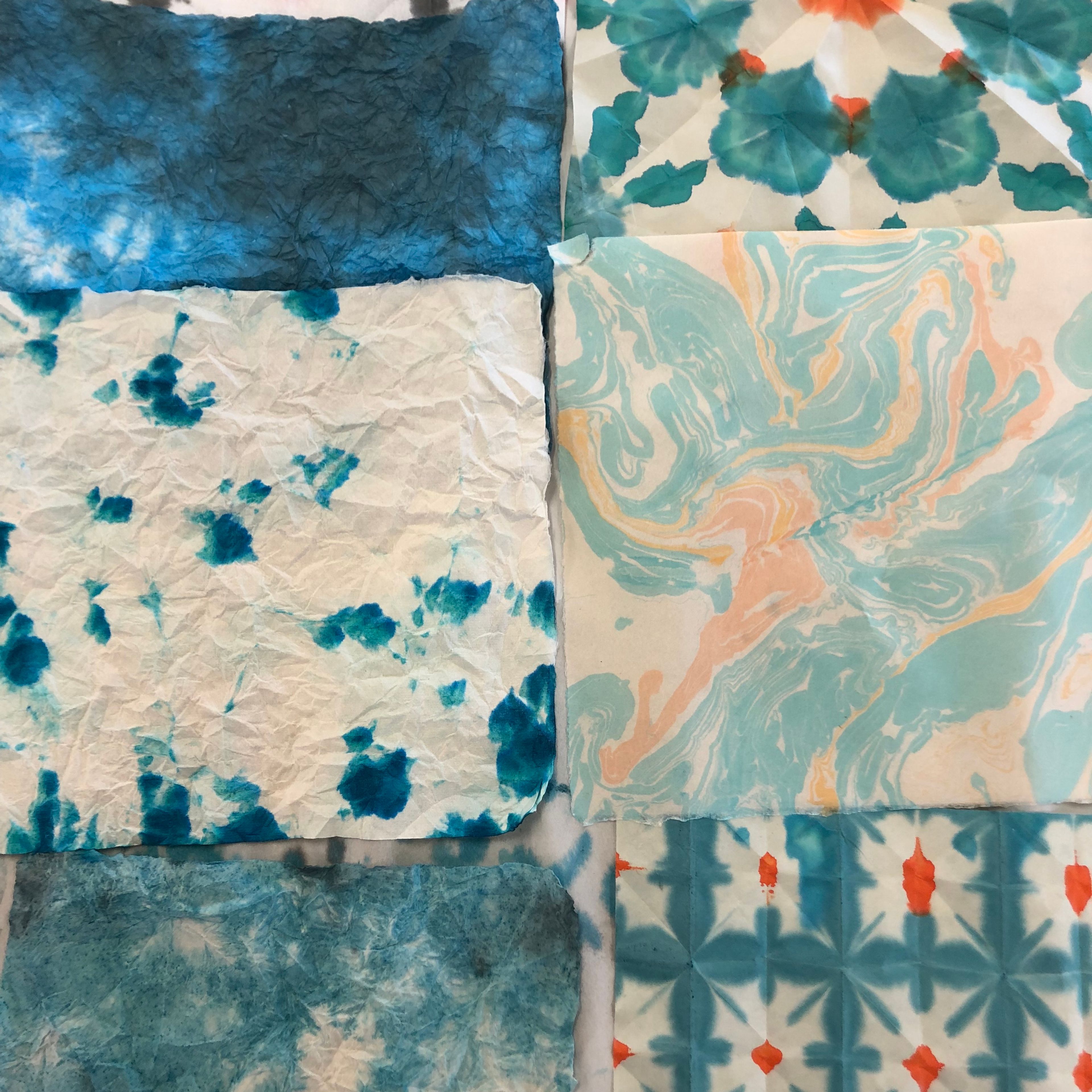 examples of marbling; multiple patterns and muted cyan colours