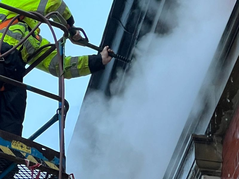 Steam (DOFF) cleaning brick work from MEWP