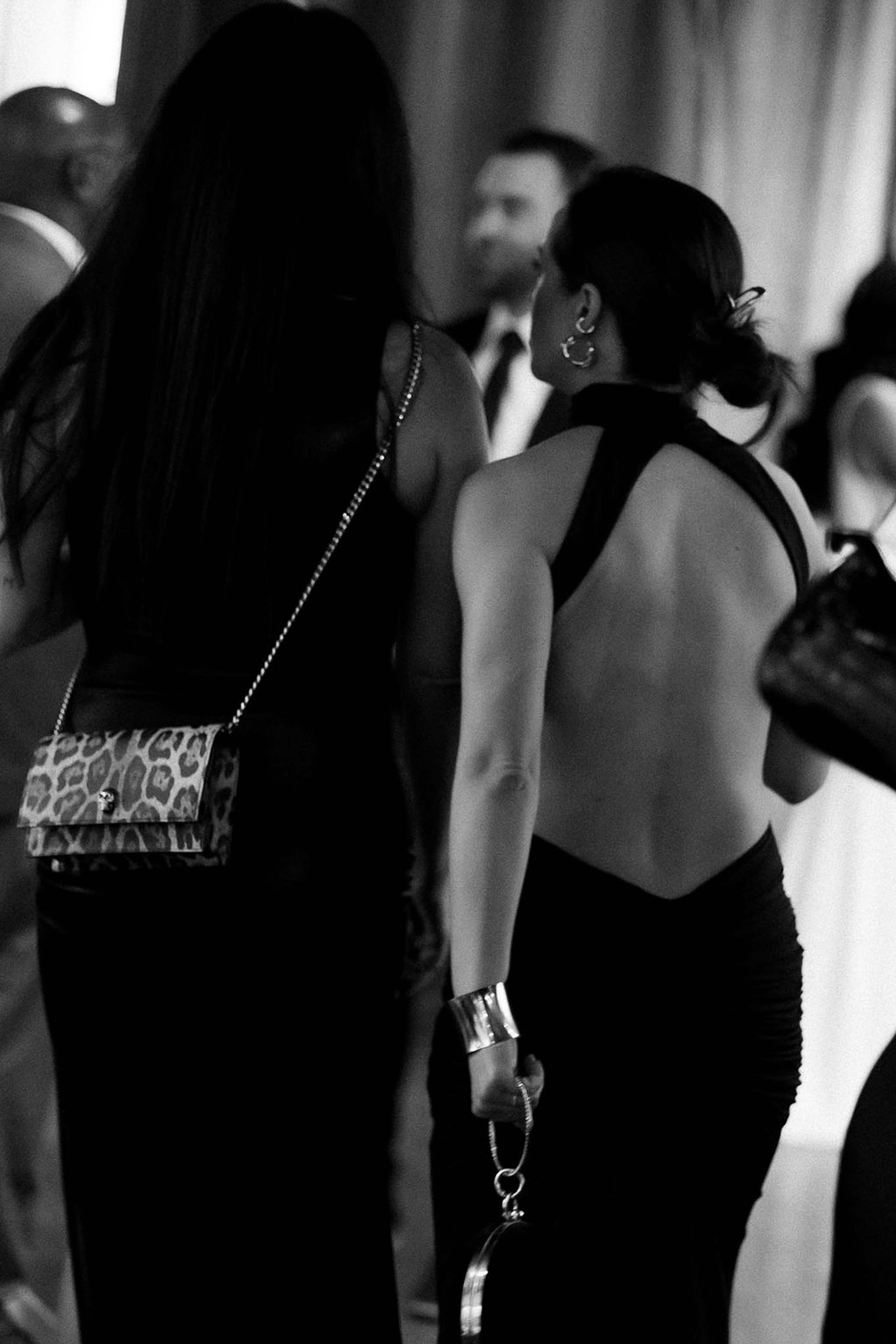 Two guests from behind in evening gowns