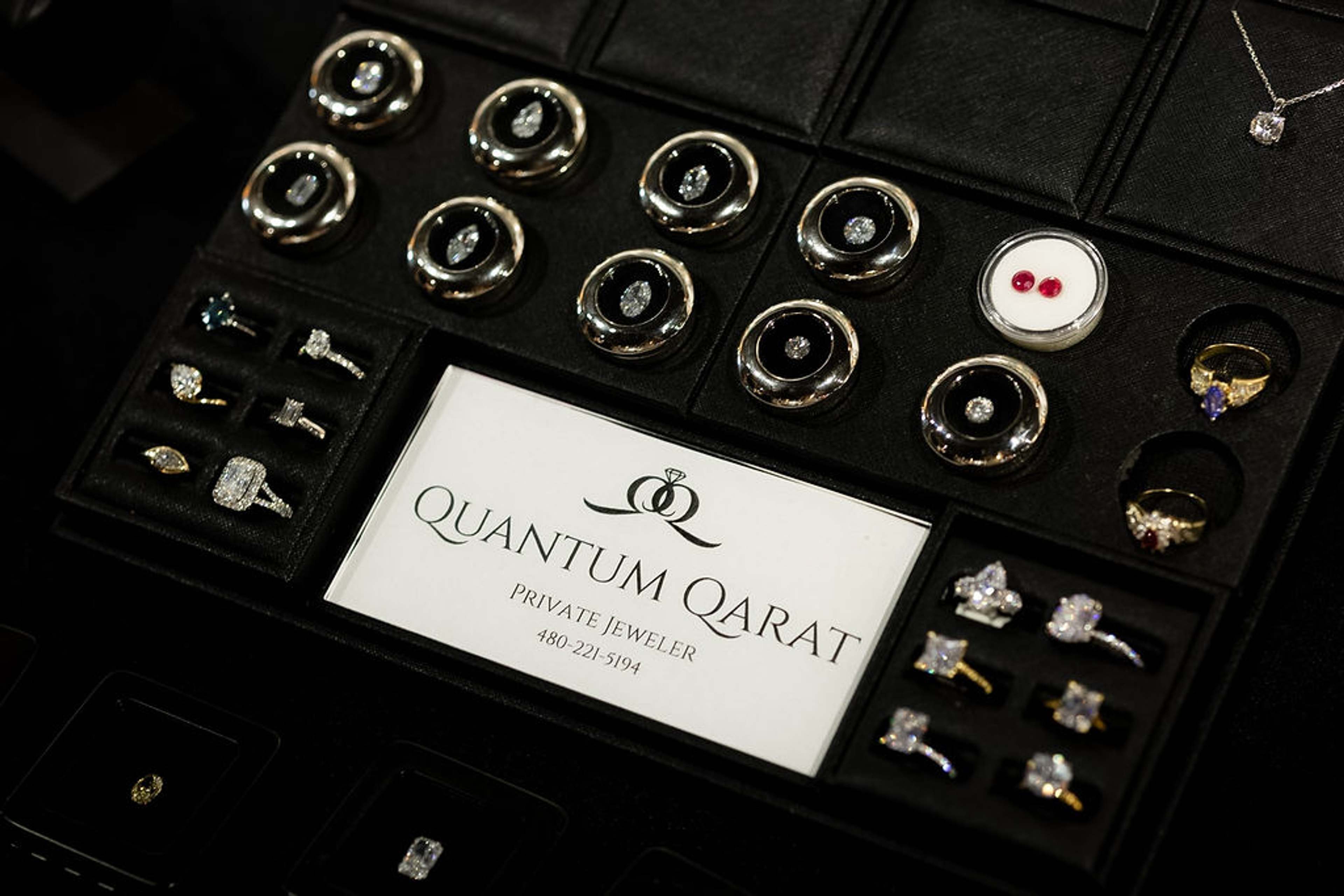 Jeweller's display of rings and bracelets on black velvet