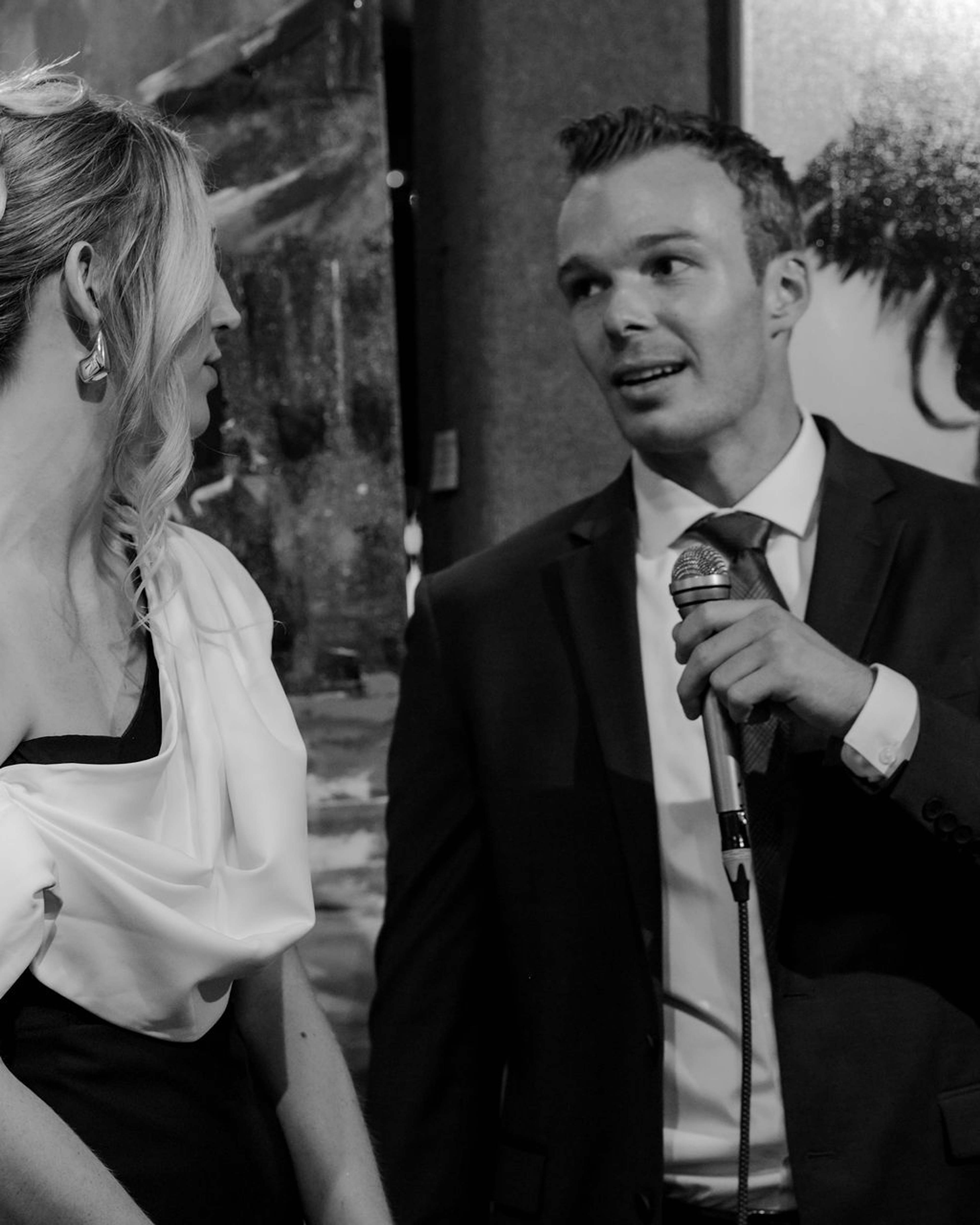 Guest speaking into a microphone during the remarks