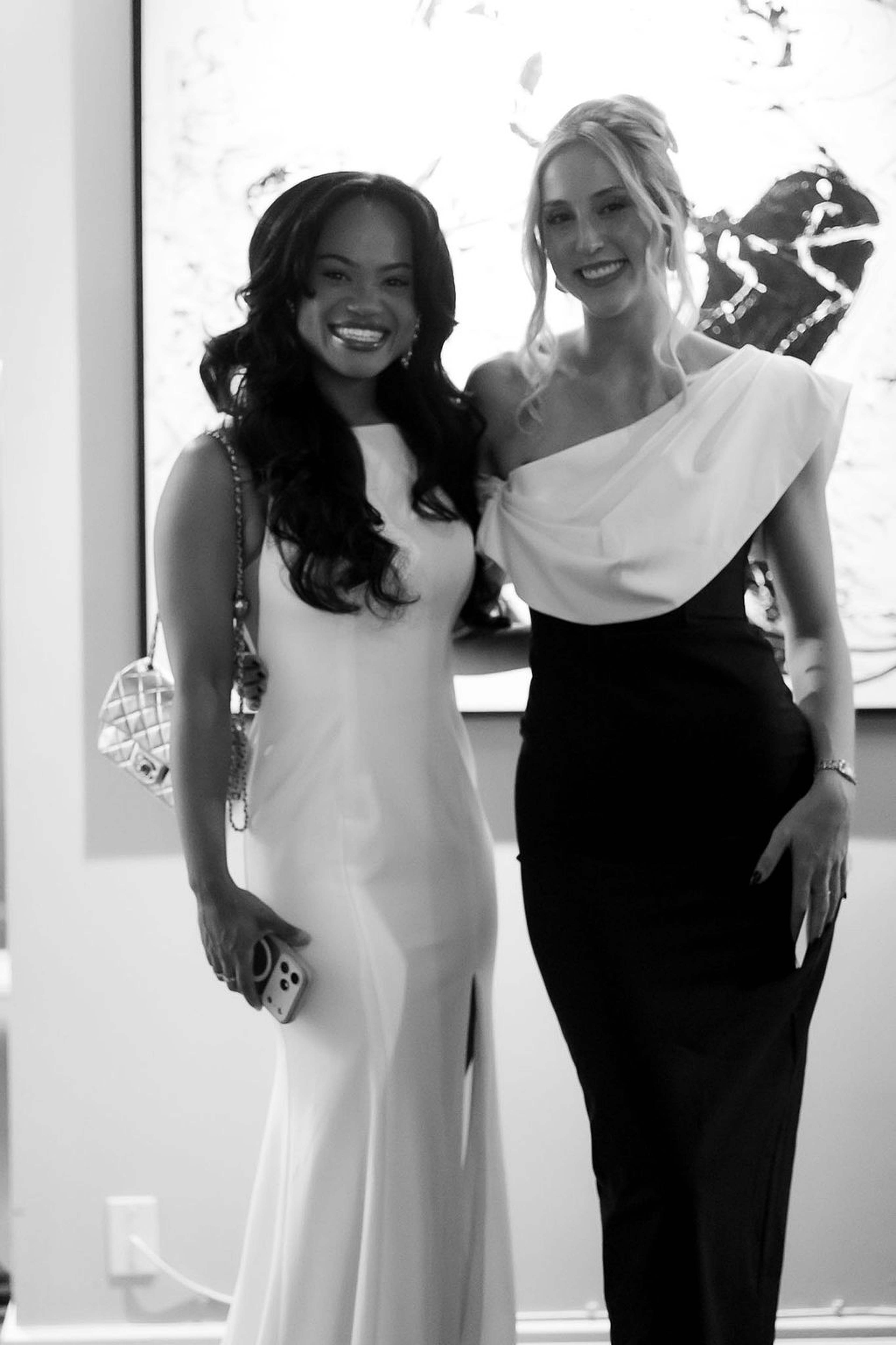 Two guests posed together in evening gowns