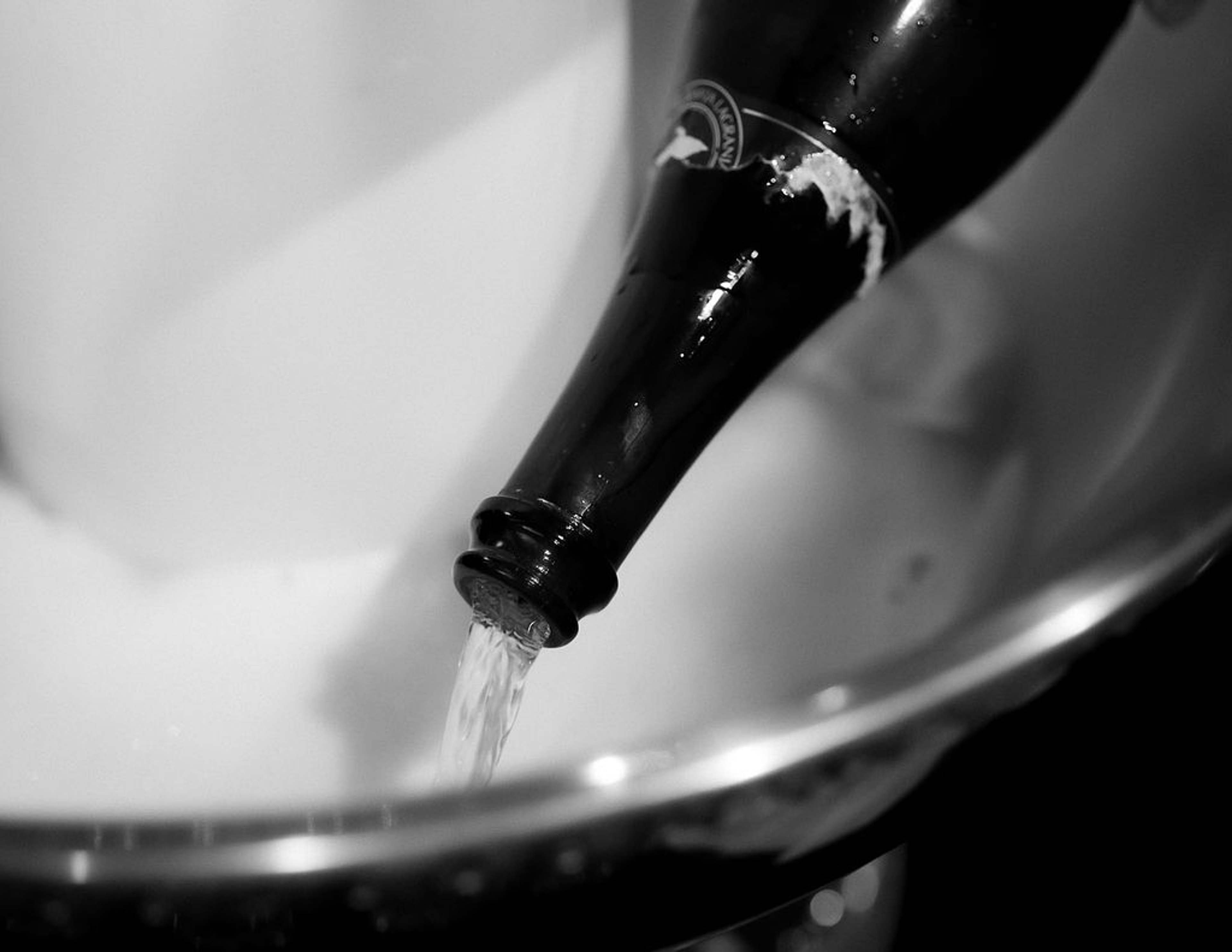 Champagne poured into a chilled ice bucket