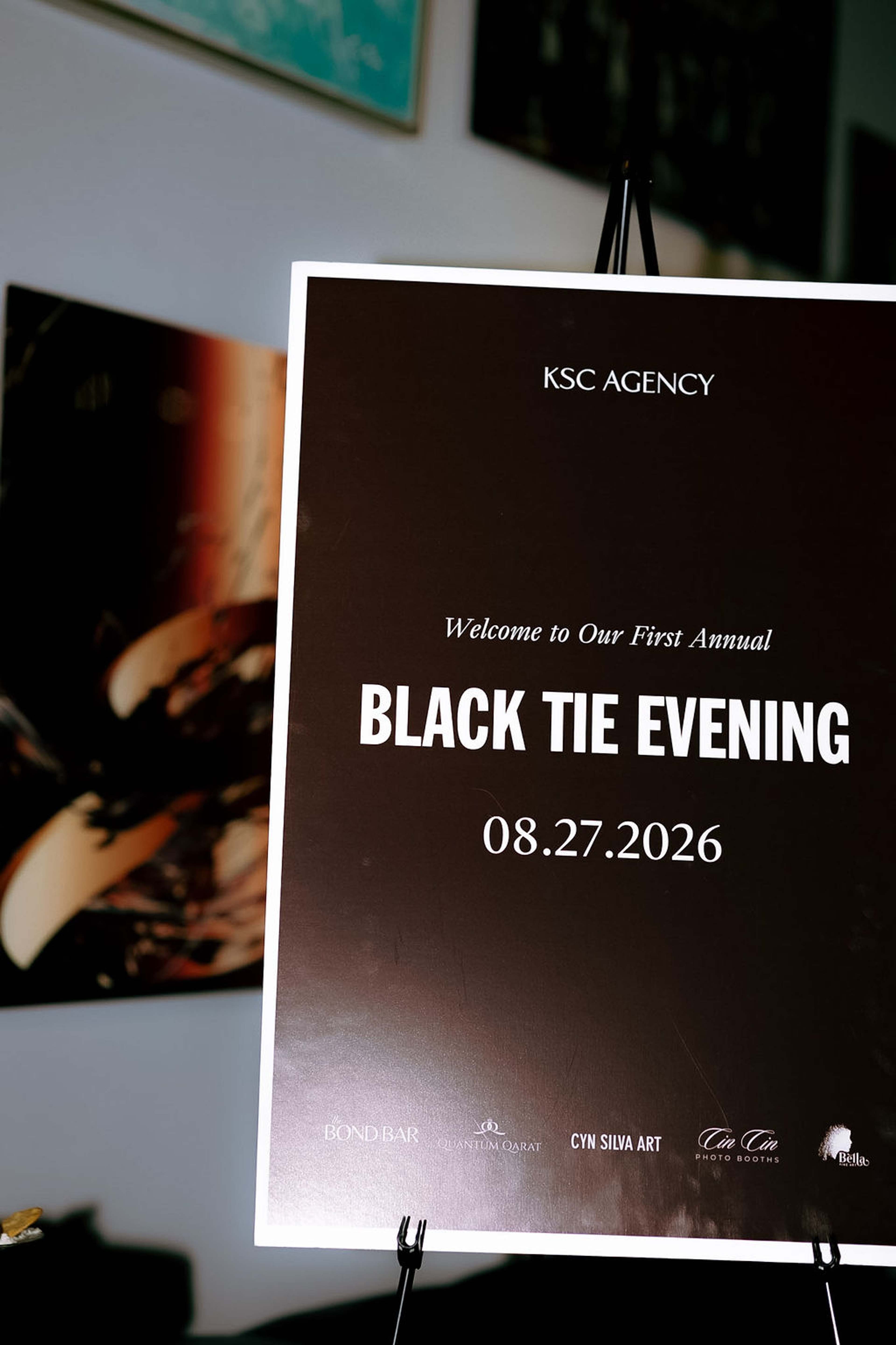 Event signage reading: KSC Agency, Welcome to Our First Annual Black Tie Evening, 08.27.2026