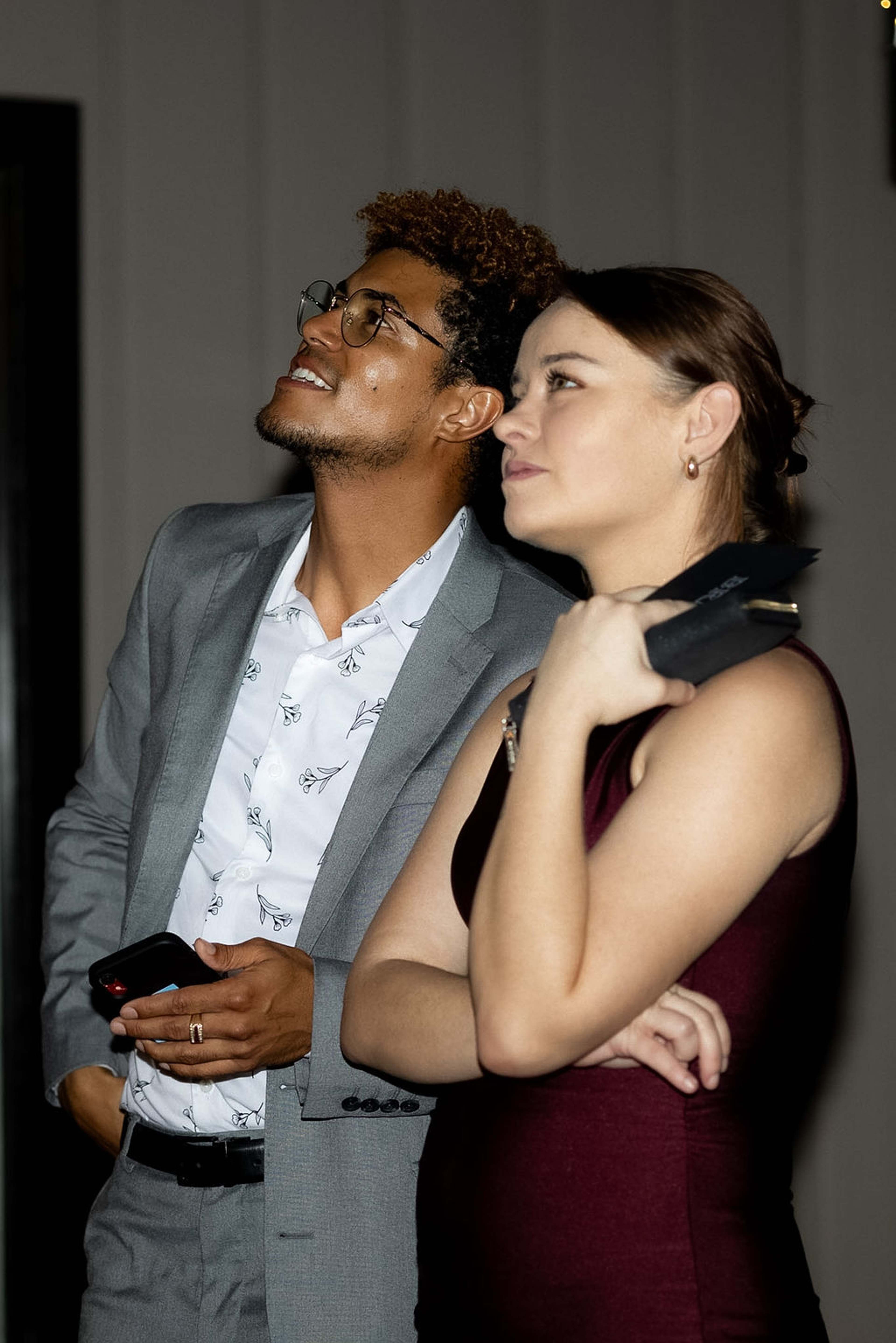 A couple watching the presentation together