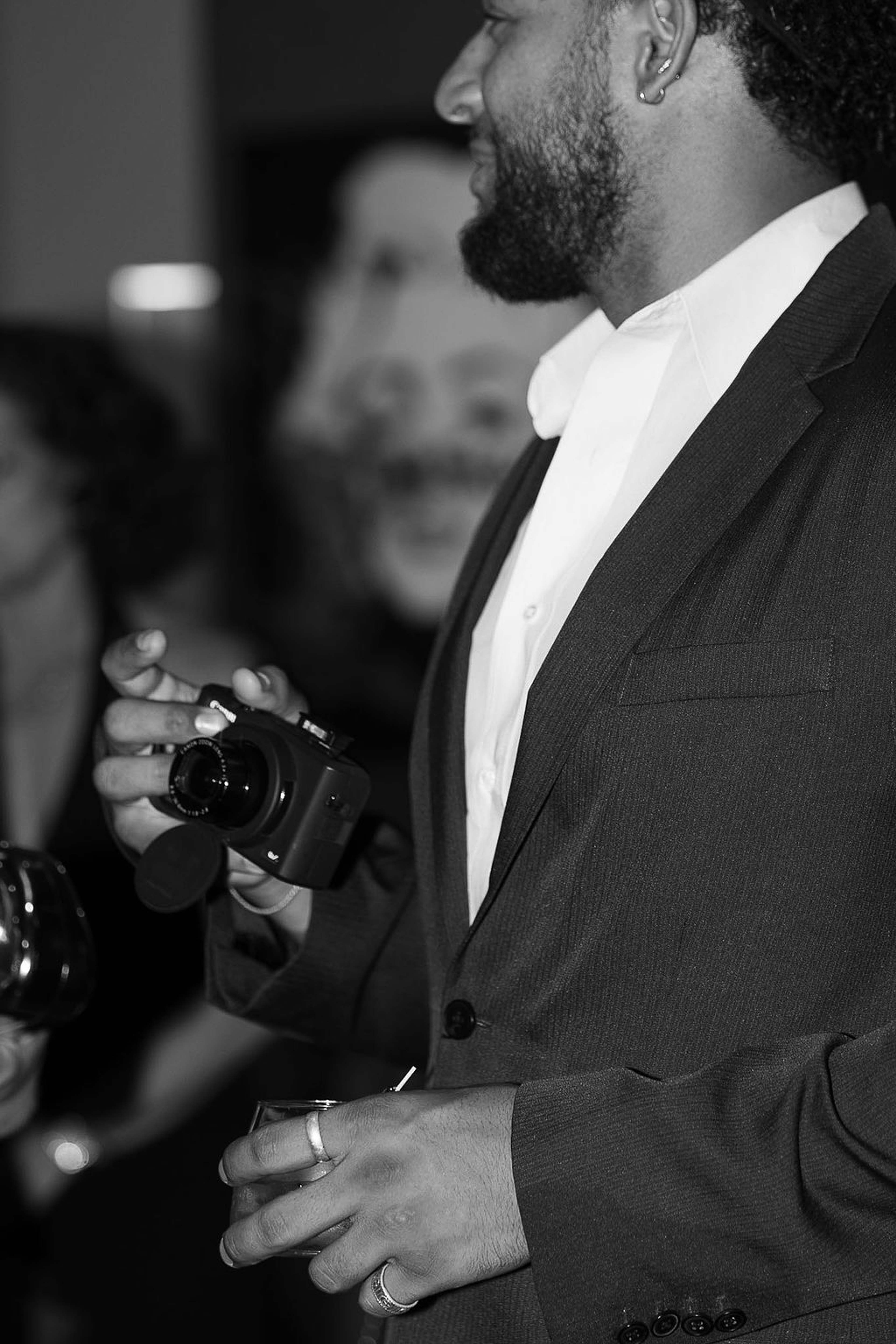 Guest holding a camera during the evening