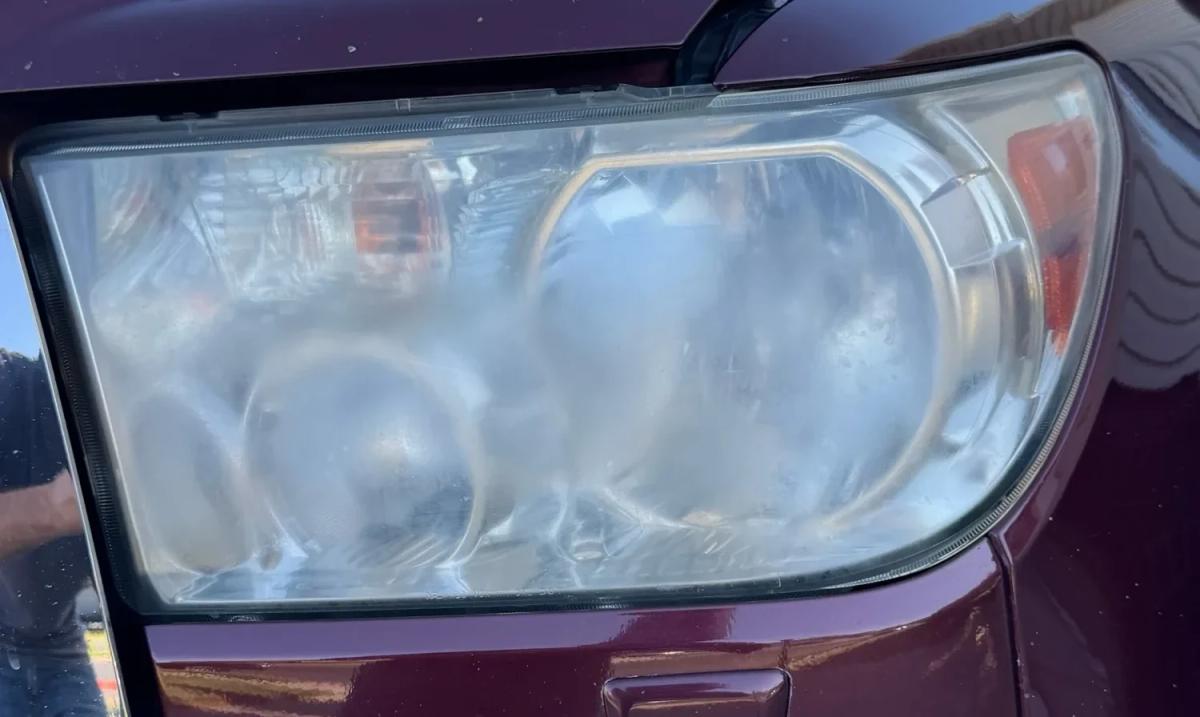 Headlight restoration truck — before repair