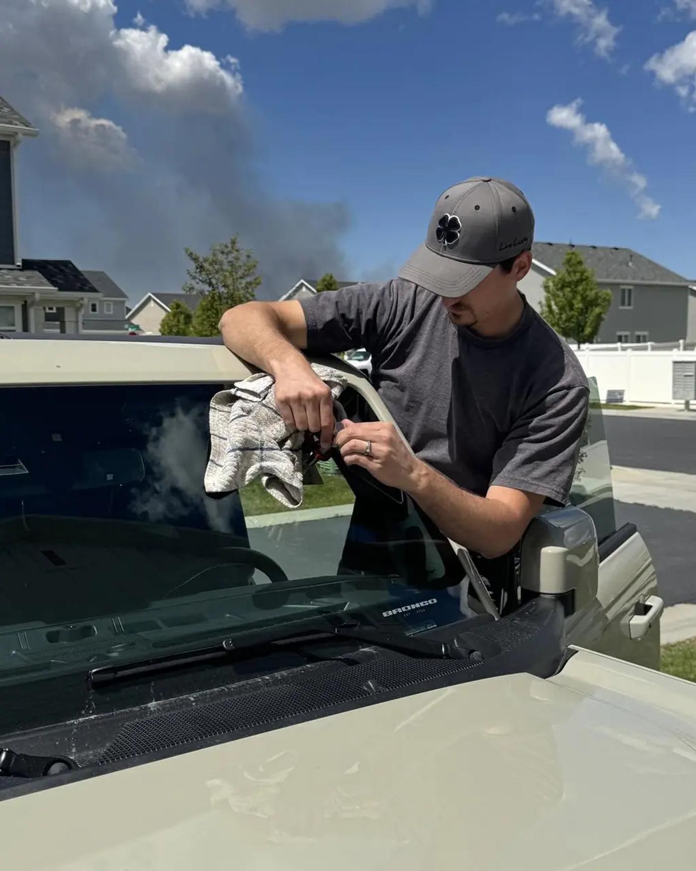 Windshield repair technician at work — RapidChip Mobile Repair
