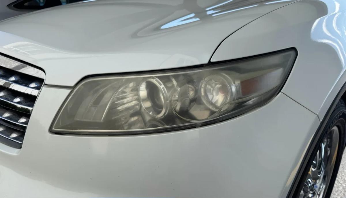 Headlight restoration SUV — before repair