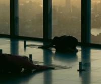 Yoga class in front of floor to ceiling windows with London skyline