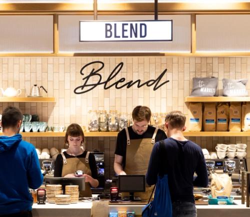 People ordering coffees from Blend counter