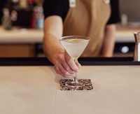 Bartender serving cocktail