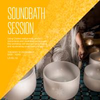 Woman kneeling in front of sound bath bowls