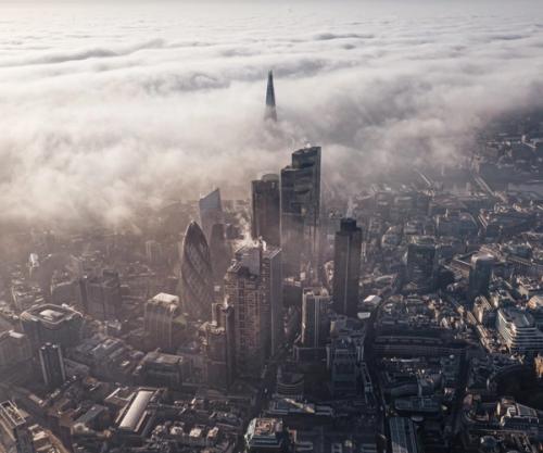 Aerial view of London bathed in clouds