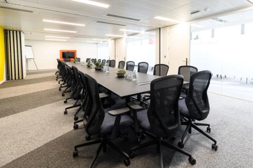 Boardroom with chairs surrounding table