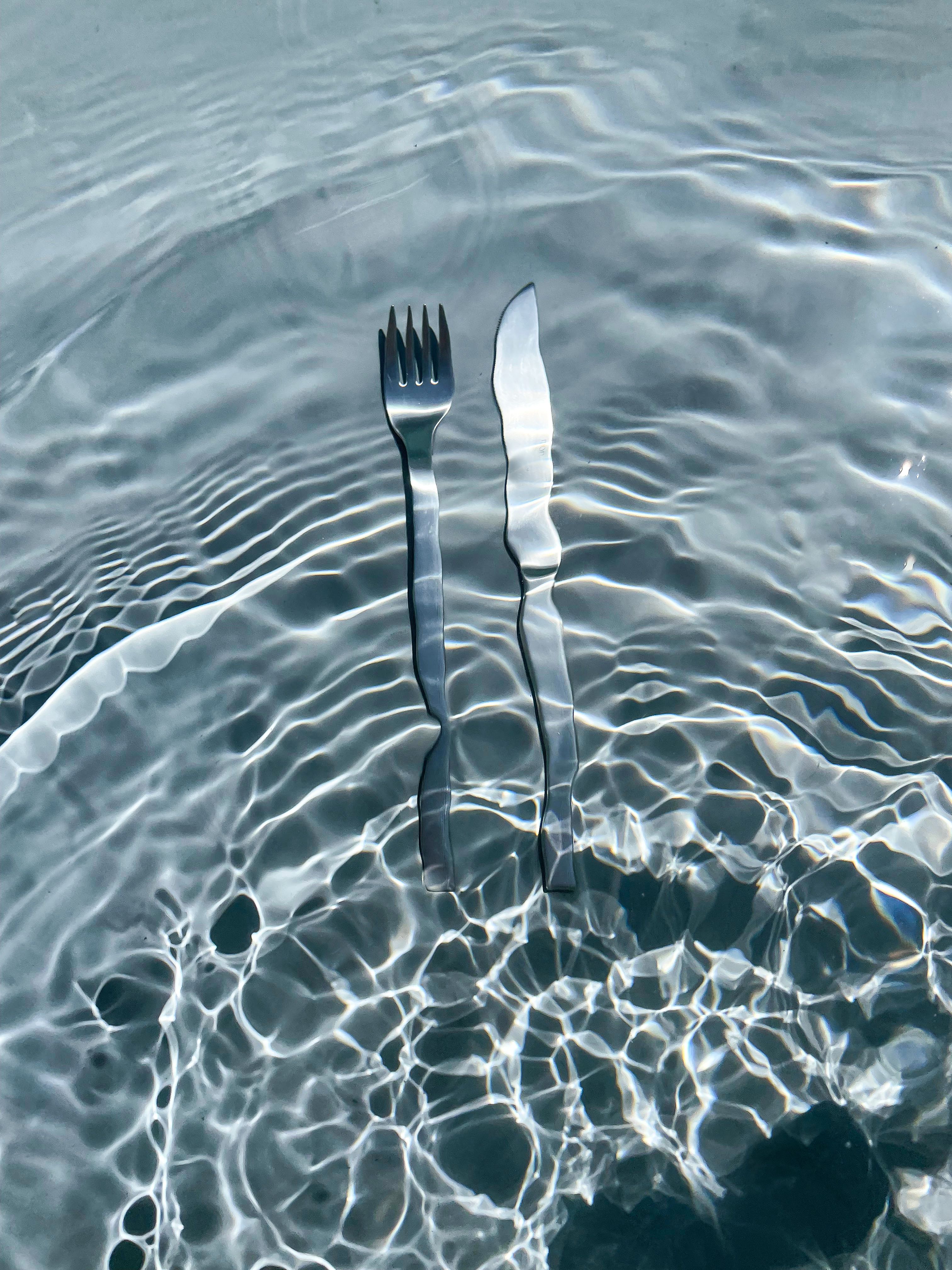 Knife and Fork in a swimming pool