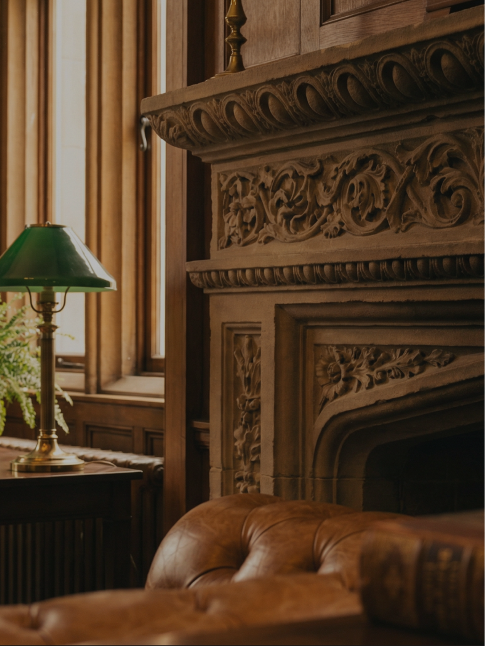 Ornate fireplace mantel and leather chair, representing the Accounting practice area