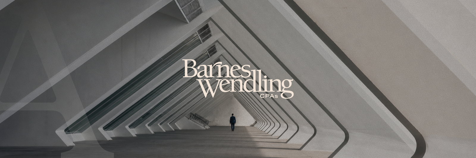 A man walks down a modern, angular corridor with "Barnes Wendling CPAs" overlaid on the image.