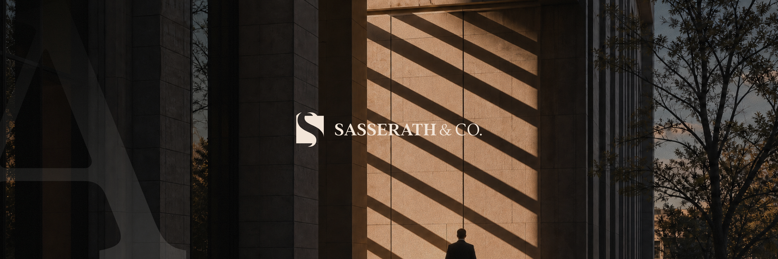 SASSARATH & CO. logo on a building facade with sharp diagonal shadows, a person walks below.
