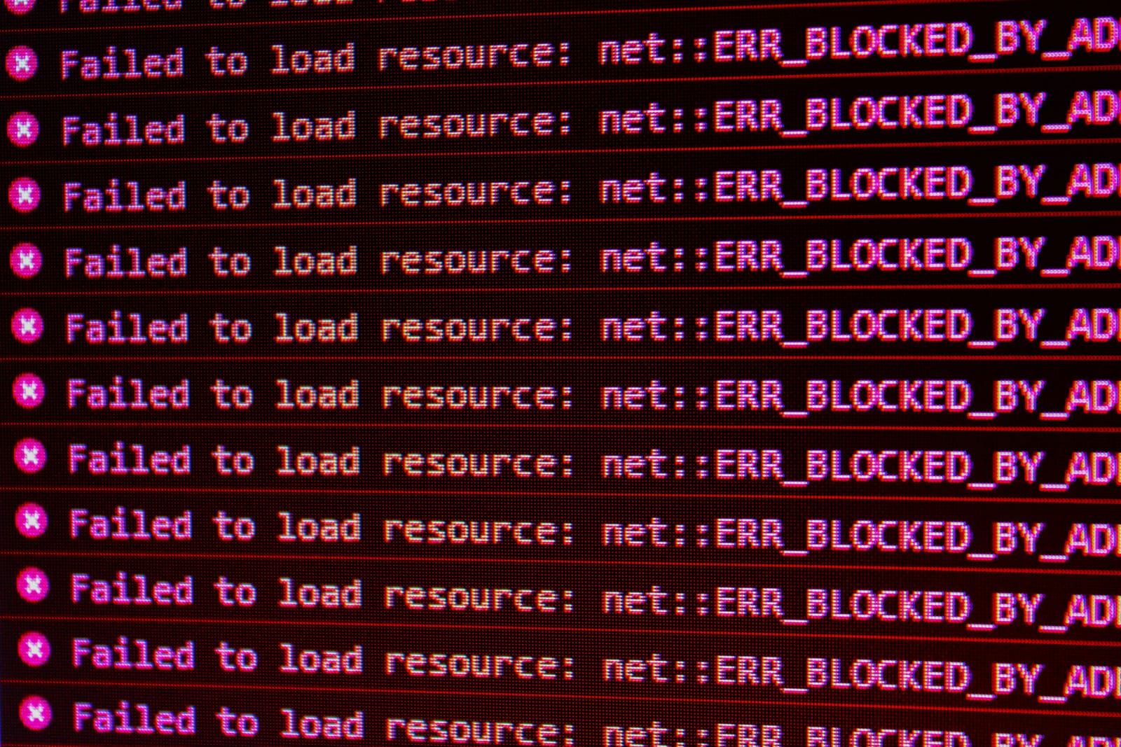 Close-up of a screen showing repeated red failed-to-load error messages