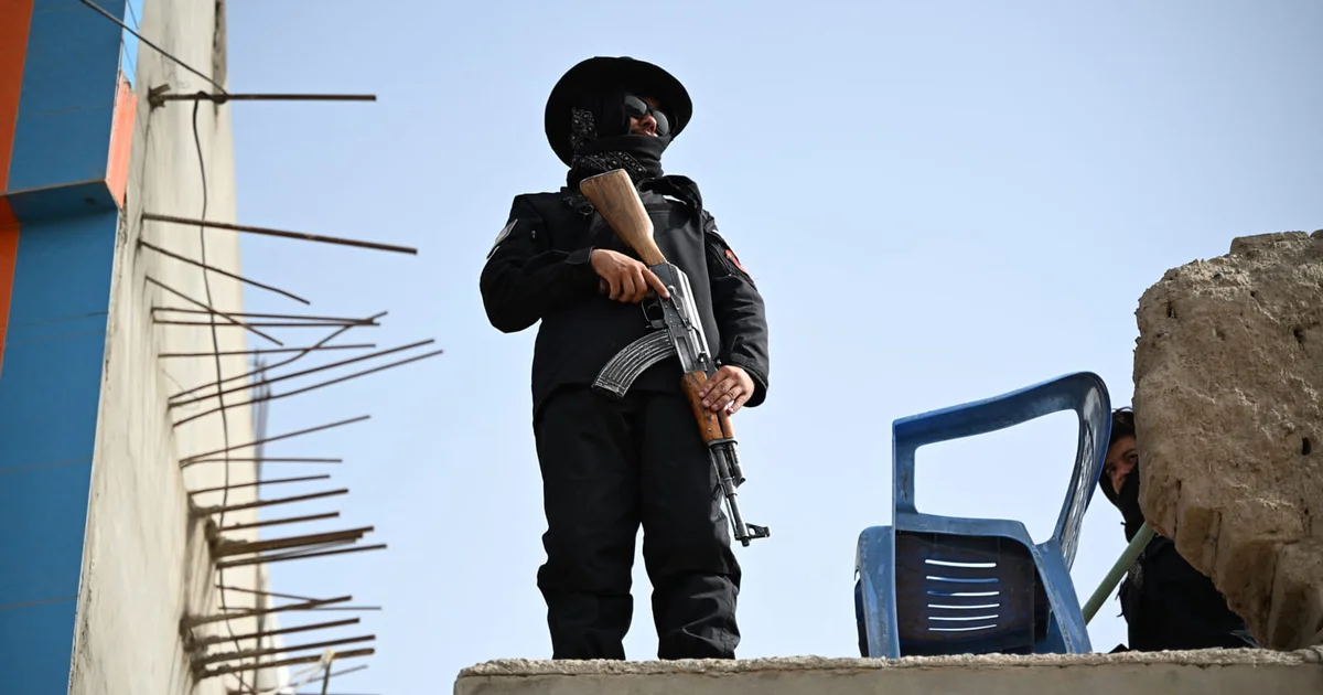 Photo: lowyinstitute.org An armed man standing on a rooftop