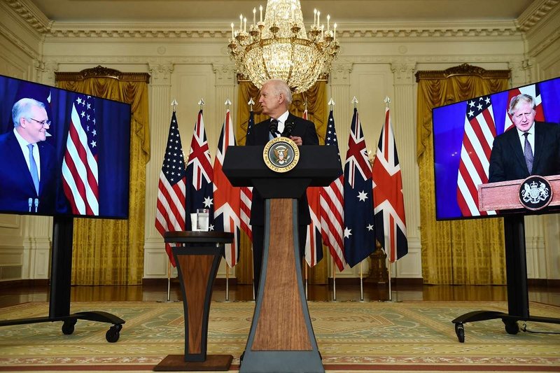 US President Joe Biden talking to Australian Prime Minister Scott Morrison and UK Prime Minister Boris Johnson via video link