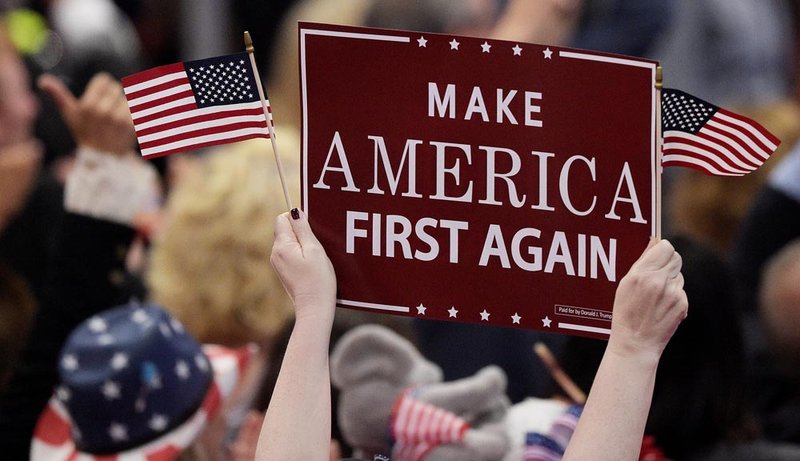 Supporter holding 'Make America Great Again' sign